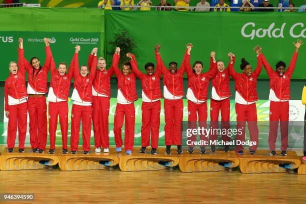 Gold medalists England pose during the medal ceremony for the Netball Gold Medal Match on day 11 of the Gold Coast 2018 Commonwealth Games at Coomera...