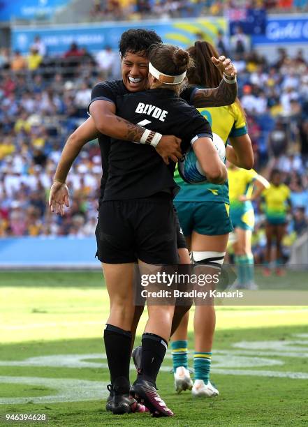 Michaela Blyde of New Zealand is congratulated by team mate Gayle Broughton after scoring a try in the WomenÕs Gold Medal Final match between...