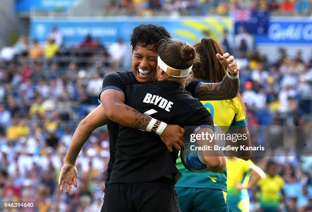 Michaela Blyde of New Zealand is congratulated by team mate Gayle Broughton after scoring a try in the WomenÕs Gold Medal Final match between...