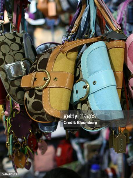 Fake Coach and other luxury brand name hand bags are displayed at the Silk Market in Beijing on Thursday, August 3, 2006. LVMH Moet Hennessy Louis...