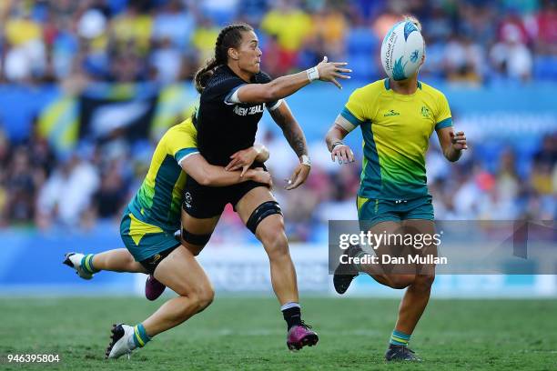 New Zealand Niall Williams offloads the ball in the Women's Gold Medal Rugby Sevens Match between Australia and New Zealand on day 11 of the Gold...