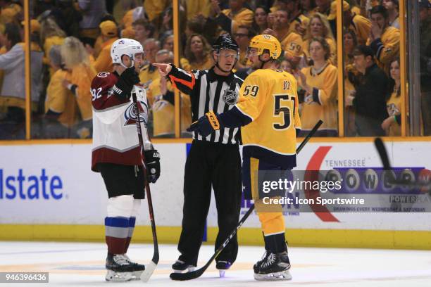 Nashville Predators defenseman Roman Josi and Colorado Avalanche left wing Gabriel Landeskog talk with referee Dan O'Rourke during Game Two of Round...