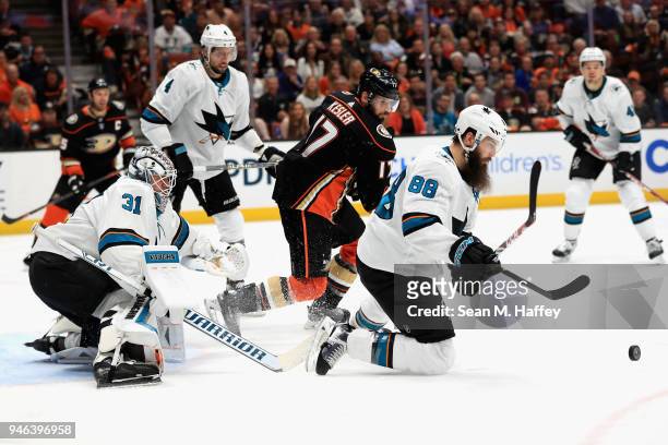 Martin Jones and Brent Burns of the San Jose Sharks defend against Ryan Kesler of the Anaheim Ducks during the third period in Game Two of the...
