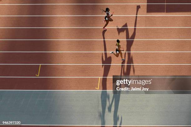 Athletes compete in the Women's 4x400 metres relay final during athletics on day 10 of the Gold Coast 2018 Commonwealth Games at Carrara Stadium on...