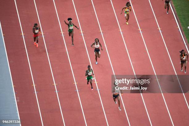 Athletes compete in the Women's 4x400 metres relay final during athletics on day 10 of the Gold Coast 2018 Commonwealth Games at Carrara Stadium on...