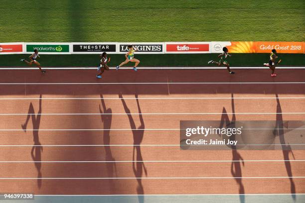 Athletes compete in the Women's 4x400 metres relay final during athletics on day 10 of the Gold Coast 2018 Commonwealth Games at Carrara Stadium on...