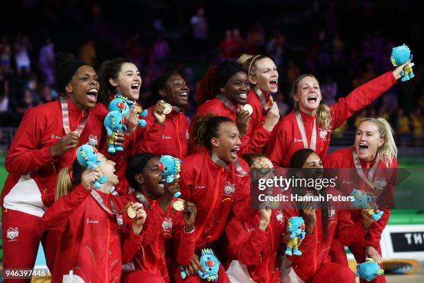 Gold medalists England pose during the medal ceremony for the Netball Gold Medal Match on day 11 of the Gold Coast 2018 Commonwealth Games at Coomera...