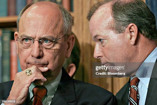Rep. Doc Hastings, , chairman of the House ethics committee, left, and listens to Ed Cassidy, his chief of staff, during a news conference in...