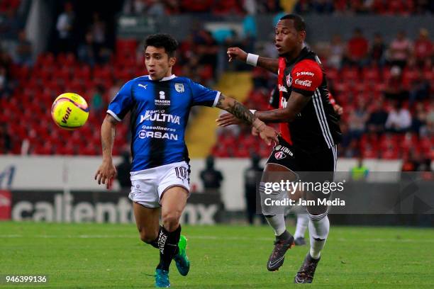 Edson Puch of Queretaro and Leiton Jimenez of Atlas fight for the ball during the 15th round match between Atlas and Queretaro at Estadio Jalisco on...