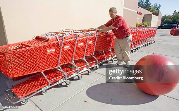 Employee Michael Bell lines up shopping carts at a Target department store in Beaverton, Oregon on Thursday, October 5, 2006. Target Corp., the...