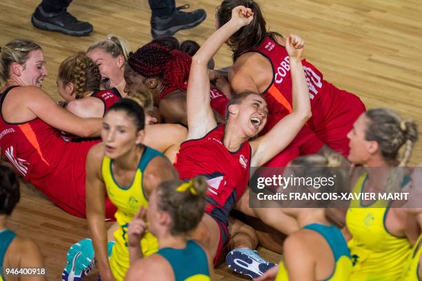 The England team poses with their gold medals after beating Australia in the women's netball gold medal match during the 2018 Gold Coast Commonwealth...