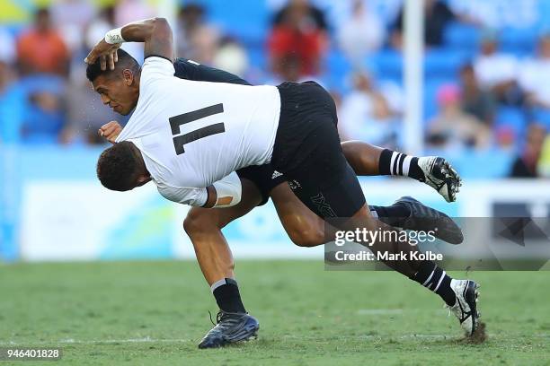 Fiji Eroni Sau tackles New Zealand Etene Nanai-Seturo in the Men's Gold Medal Rugby Sevens Match between Fiji and New Zealand on day 11 of the Gold...
