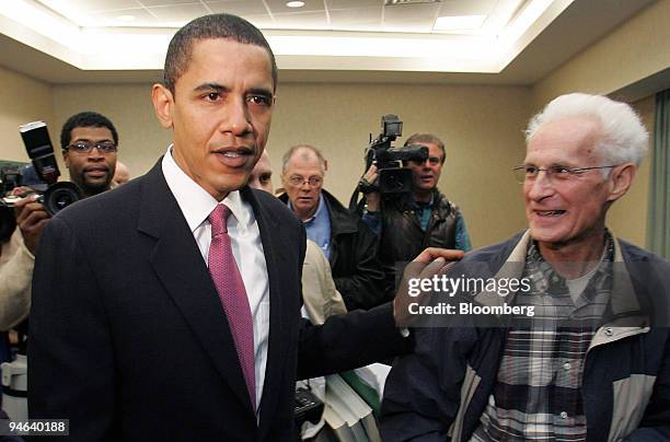 Senator Barack Obama, left, gestures to a worker from one of two Illinois nuclear plants that was affected by nuclear waste, prior to Obama's...