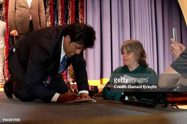 Erik Estrada signs autographs for a fan on stage after the conclusion of the 2018 Mr. Mature America Pageant at The Music Pier on April 14, 2018 in...