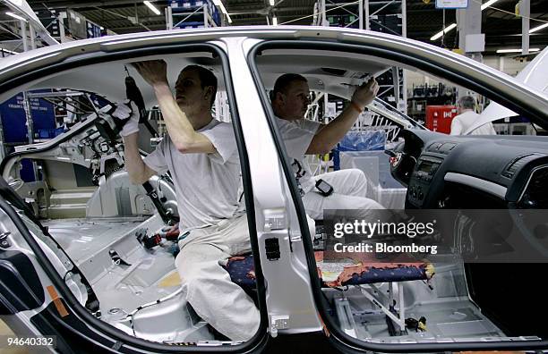 Auto workers assemble cars at Skoda Auto S.A.. In Mlada Boleslav, Czech Republic, on Tuesday, December 12, 2006.
