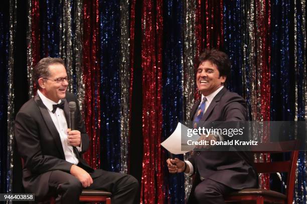 Erik Estrada asks an interview question of contestant, John Walton as part of the On Stage Interview at the 2018 Mr. Mature America Pageant at The...
