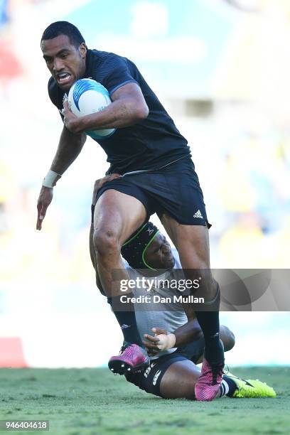 New Zealand Sione Molia is tackled in the Men's Gold Medal Rugby Sevens Match between Fiji and New Zealand on day 11 of the Gold Coast 2018...