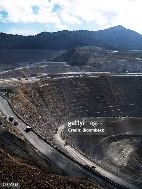 Clouds hang over the PT Newmont Nusa Tenggara copper and gold mining pit in Batu Hijau, in the Sumbawa Barat district, eastern Indonesia on...