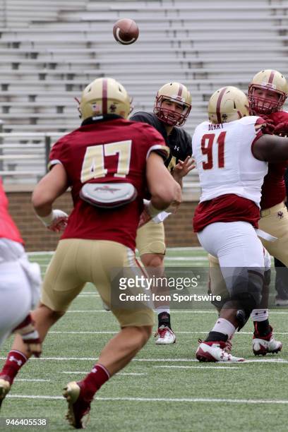 Perry passes to Fullback Colton Cardinal during the Boston College Jay MCGillis Memorial Spring Game on April 14 at Alumni Stadium in Chestnut Hill,...