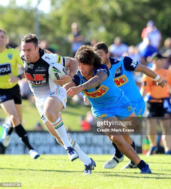 James Maloney of the Panthers gets away from Kevin Proctor of the Titans during the round six NRL match between the Penrith Panthers and the Gold...