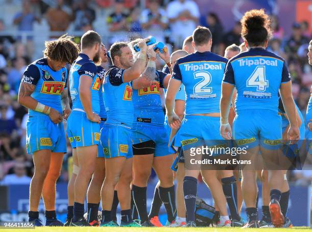 Michael Gordon of the Titans sprays himself with water after a Panthers try during the round six NRL match between the Penrith Panthers and the Gold...