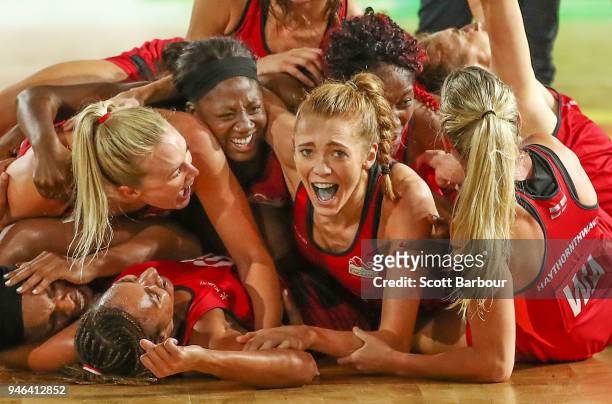 Helen Housby , who scored in the final second and her England teammates celebrate at full time and winning the Netball Gold Medal Match between...