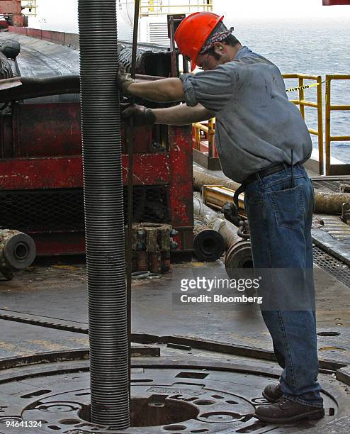 Chris Tauntin replaces choke-line aboard the Discoverer Deep Seas, a Transocean deepwater drill ship, Monday, December 11 in the Gulf of Mexico at...