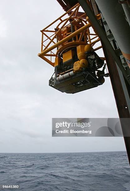 An underwater remotely operated vehicle returns to Discoverer Deep Seas, a Transocean deepwater drill ship, , Monday, December 11 in the Gulf of...