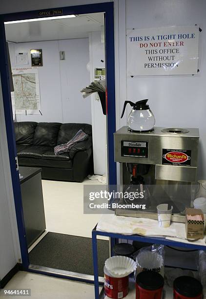 Sign states, "THIS IS A TIGHT HOLE. DO NOT ENTER THIS OFFICE WITHOUT PERMISSION," aboard the Discoverer Deep Seas, a Transocean deepwater drill ship,...