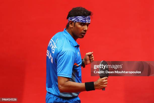 Sharath Achanta of India celebrates a point during Table Tennis Men's Singles Bronze Medal match between Sharath Achanta of India and Samuel Walker...