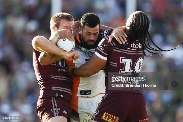 Ben Matulino of the Tigers is tackled by the Sea Eagles defence during the round six NRL match between the Manly Sea Eagles and the Wests Tigers at...