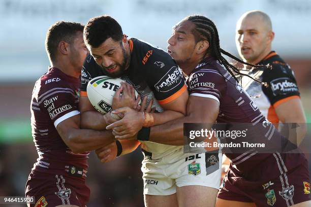 Ben Matulino of the Tigers is tackled by the Sea Eagles defence during the round six NRL match between the Manly Sea Eagles and the Wests Tigers at...