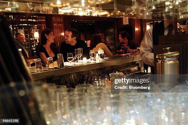 Patrons drink at the bar at Cafe Gray, a restaurant located in the Time Warner Center at 10 Columbus Circle in New York, U.S., on Tuesday, Dec. 11,...