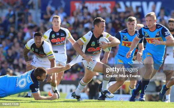 James Maloney of the Panthers is tackled by Max King of the Titans during the round six NRL match between the Penrith Panthers and the Gold Coast...