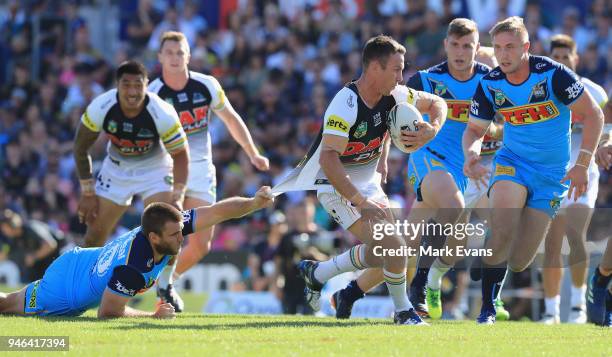 James Maloney of the Panthers is tackled by Max King of the Titans during the round six NRL match between the Penrith Panthers and the Gold Coast...