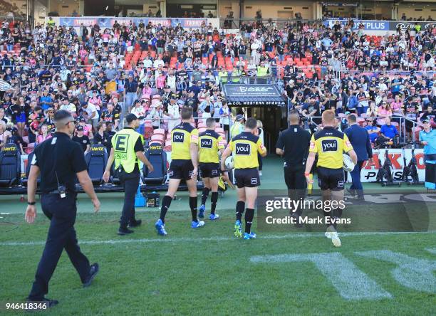 The Referees are escorted off the ground after the round six NRL match between the Penrith Panthers and the Gold Coast Titans on April 15, 2018 in...