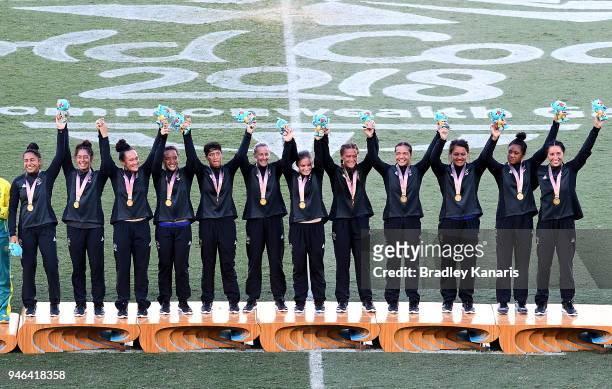 The New Zealand team celebrate winning gold in the WomenÕs Gold Medal Final match between Australia and New Zealand during Rugby Sevens on day 11 of...