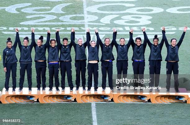 The New Zealand team celebrate winning gold in the WomenÕs Gold Medal Final match between Australia and New Zealand during Rugby Sevens on day 11 of...