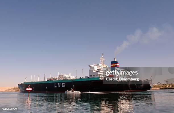 The Tenaga Satu, a Liquefied Natural Gas tanker owned by MISC Berhad, a Malaysian shipping company, sails northbound on the Suez Canal in Ismailia,...