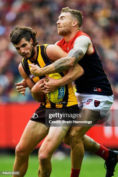 Ben Stratton of the Hawks is tackled by Dean Kent of the Demons during the round four AFL match between the Hawthorn Hawks and the Melbourne Demons...