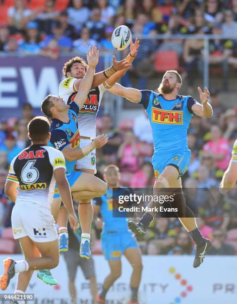 Corey Harawira-Naera of the Panthers and Ryan Simpkins of the Titans go up for a high ball during the round six NRL match between the Penrith...