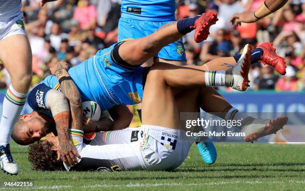 Nathan Peats of the Titans is tackled by James Fisher-Harris of the Panthers during the round six NRL match between the Penrith Panthers and the Gold...