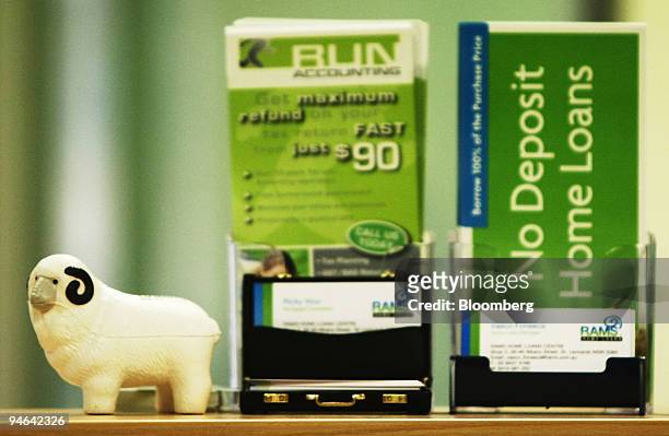 Rams Home Loans Group Pty Ltd. Product information is displayed on the counter of a Rams Home Loans shop in Sydney, Australia, on Monday, Aug. 20,...