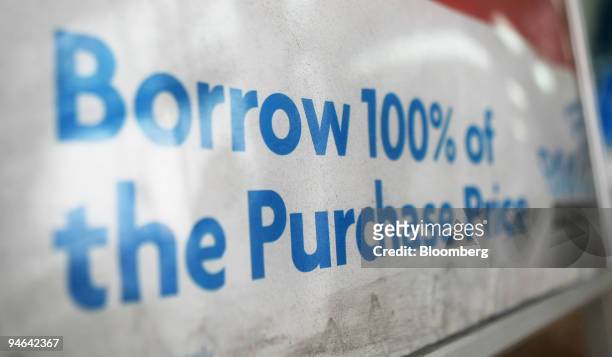 Information on a 100% mortgage is displayed on a sign outside a Rams Home Loans Group Pty Ltd. Shop in Sydney, Australia, on Monday, Aug. 20, 2007....