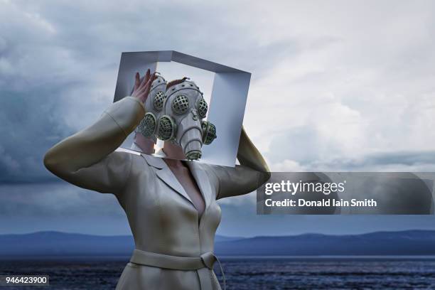 air pollution concept: woman with futuristic gas mask and head in glass cube - air respirator mask stock pictures, royalty-free photos & images