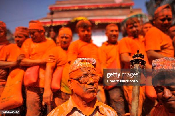 Nepalese devotee holds oil torch lamp during the celebration of &quot;Sindoor Jatra&quot; vermillion powder festival as Nepalese New Year day...