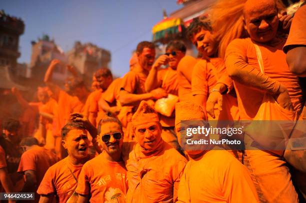 Nepalese devotees pose for the photos after applying vermillion powder towards his friends during the celebration of &quot;Sindoor Jatra&quot;...