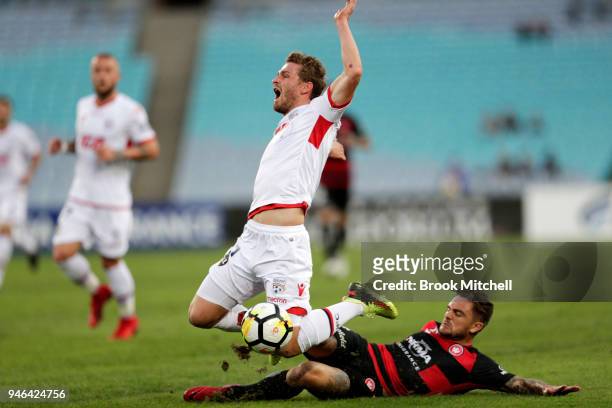 Josh Risdon of the Western Sydney Wanderers tackles Vince Lia of Adelaide United during the round 27 A-League match between the Western Sydney...