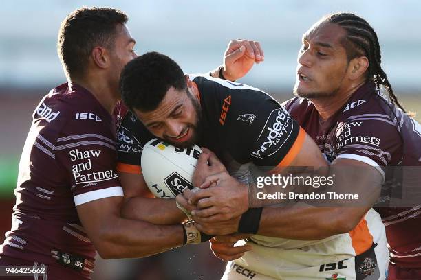 Ben Matulino of the Tigers is tackled by the Sea Eagles defence during the round six NRL match between the Manly Sea Eagles and the Wests Tigers at...