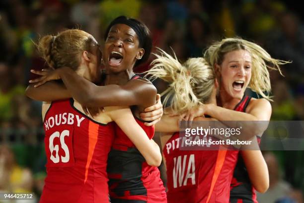 Helen Housby, who scored in the final second, Jodie Gibson and their England teammates celebrate at full time and winning the Netball Gold Medal...